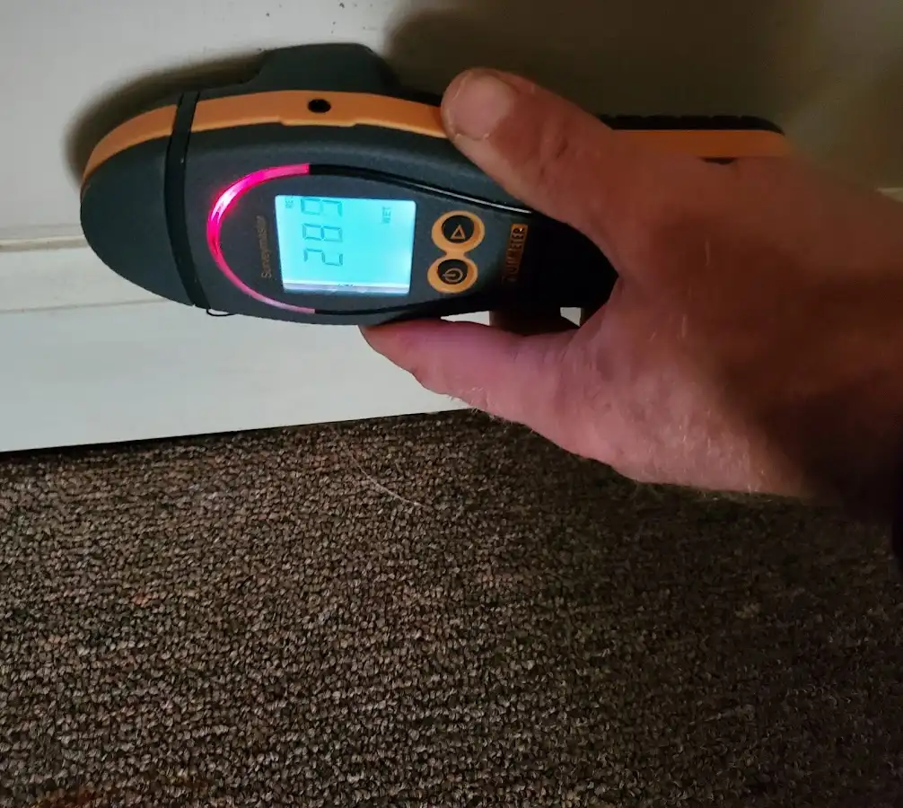 Moisture detection at baseboard during Storm Damage Restoration in Villas
